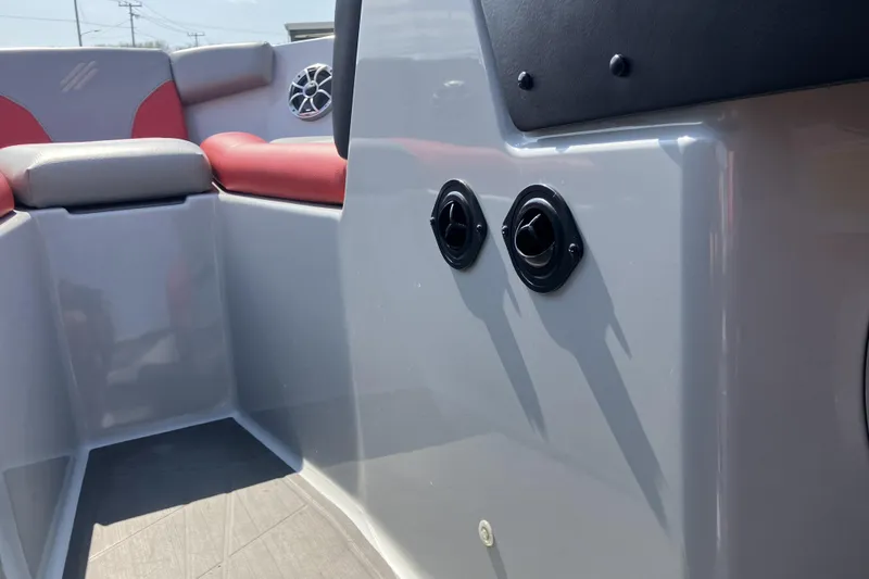 Slide: The Image of 2020 ATX Surf Boats 24 Type-S interior with red and gray seating, speaker, and controls. - 16