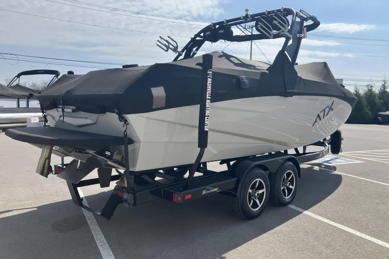 Slide: The Image of 2020 ATX Surf Boats 24 Type-S on trailer, covered and parked outdoors. - 3