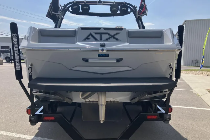 Slide: The Image of Rear view of a 2020 ATX Surf Boats 24 Type-S in a parking lot. - 8