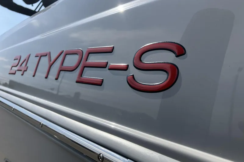 Slide: The Image of 2020 ATX Surf Boats 24 Type-S logo on sleek gray surface. - 9