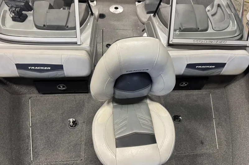 Slide: The Image of 2019 Tracker Pro Guide V-175 Combo boat interior with seating and windshield. - 14