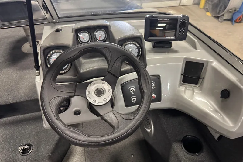 Slide: The Image of 2019 Tracker Pro Guide V-175 Combo dashboard with steering wheel and navigation system. - 7
