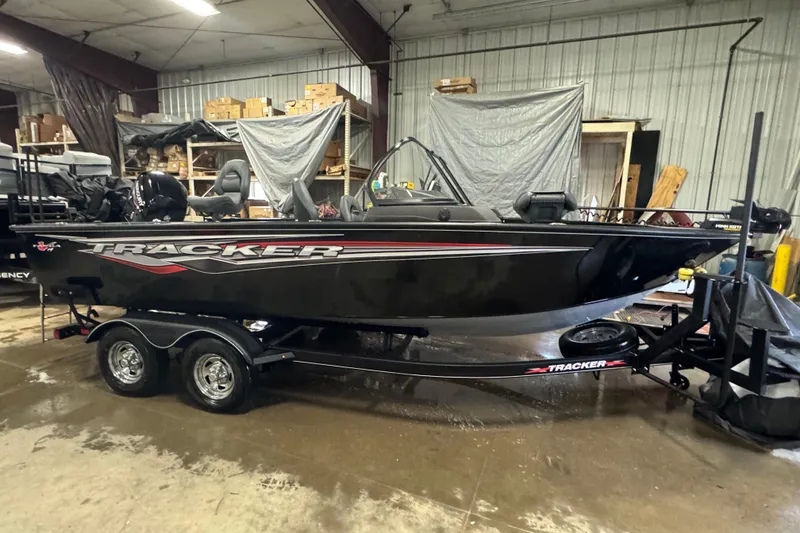 The Image of 2023 Tracker Targa V-19 WT boat in a warehouse setting on a trailer. - 0