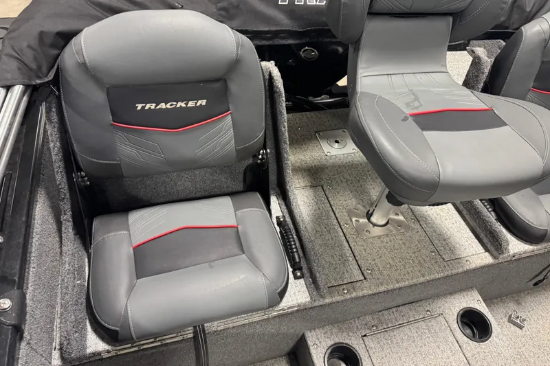 Slide: The Image of 2023 Tracker Targa V-19 WT boat seats with gray upholstery and red accents. - 6