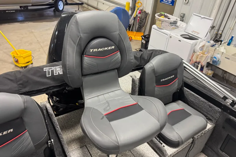 Slide: The Image of 2023 Tracker Targa V-19 WT boat seats in a garage setting. - 7