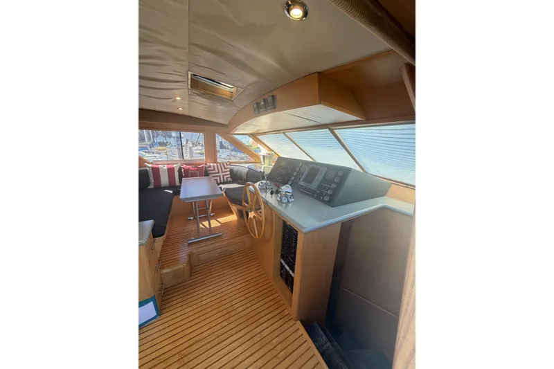 Slide: The Image of Interior of 1991 Ocean Alexander 520 Pilothouse with wooden flooring and helm station. - 10