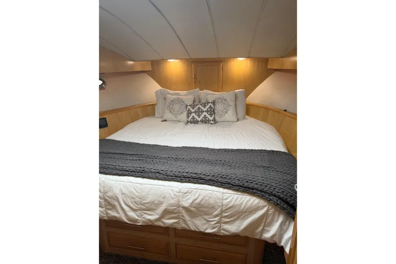 Slide: The Image of Cozy bedroom in 1991 Ocean Alexander 520 Pilothouse yacht with elegant bedding. - 16