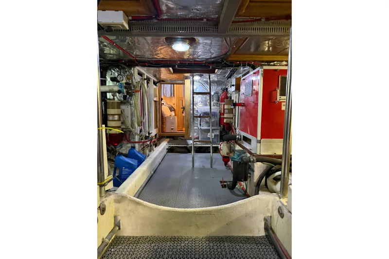 Slide: The Image of Engine room of 1991 Ocean Alexander 520 Pilothouse yacht, featuring equipment and storage. - 30