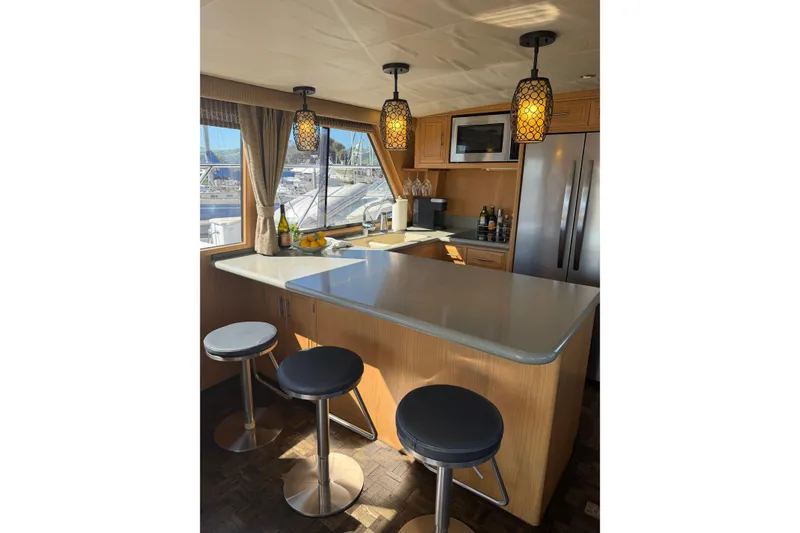 Slide: The Image of Luxurious kitchen interior of 1991 Ocean Alexander 520 Pilothouse yacht with modern amenities. - 5