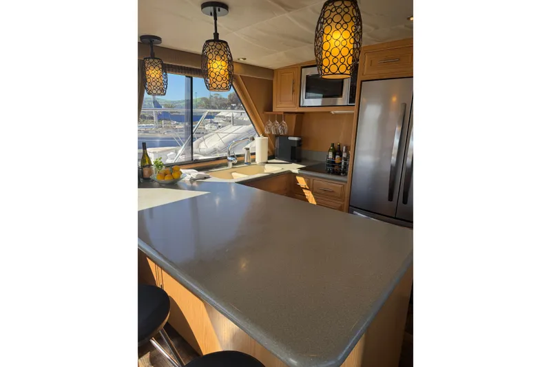 Slide: The Image of Luxurious kitchen interior of 1991 Ocean Alexander 520 Pilothouse yacht with modern appliances. - 6