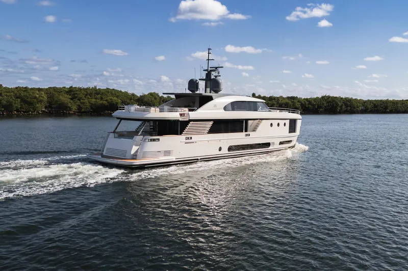 Slide: The Image of Luxury yacht Azimut Magellano 30M 2026 cruising on a serene waterway. - 2