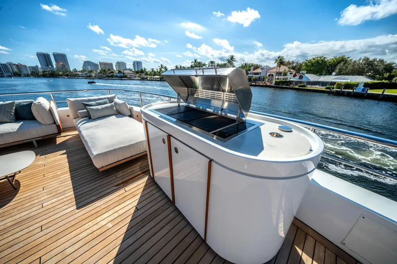 Slide: The Image of Luxurious deck of 2026 Azimut Magellano 30M yacht with grill and seating area. - 24