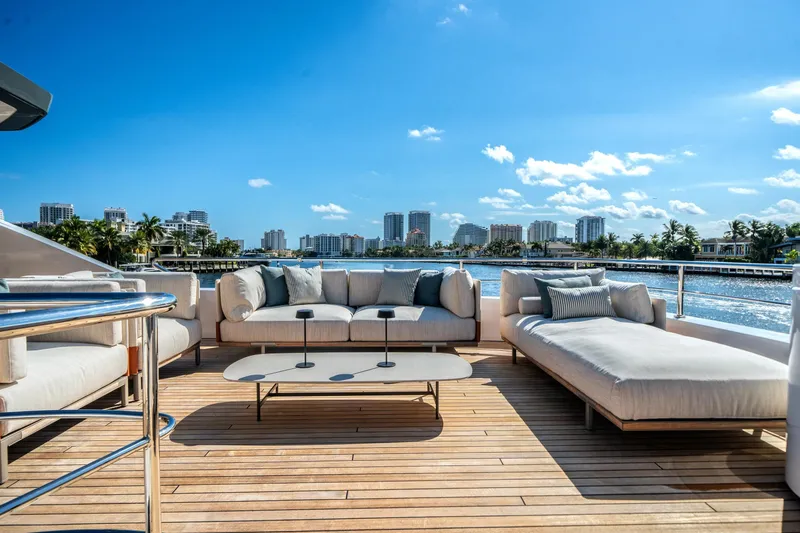 Slide: The Image of Luxurious deck of 2026 Azimut Magellano 30M yacht with elegant seating and scenic waterfront view. - 28