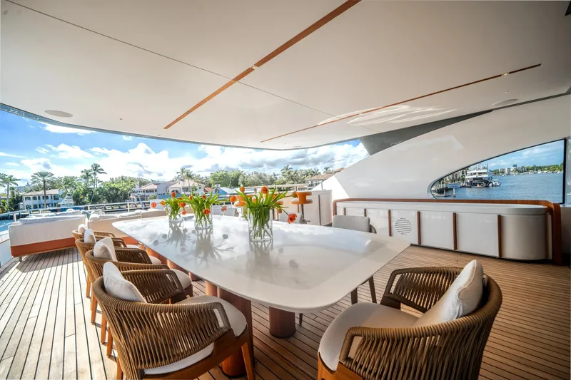 Slide: The Image of Luxurious deck of 2026 Azimut Magellano 30M yacht with elegant dining setup. - 33