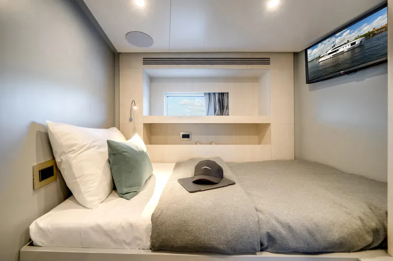 Slide: The Image of Luxurious cabin interior of 2026 Azimut Magellano 30M yacht with cozy bedding and TV. - 35