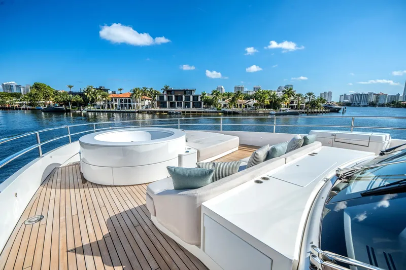 Slide: The Image of Luxurious 2026 Azimut Magellano 30M yacht deck with jacuzzi and scenic waterfront view. - 38