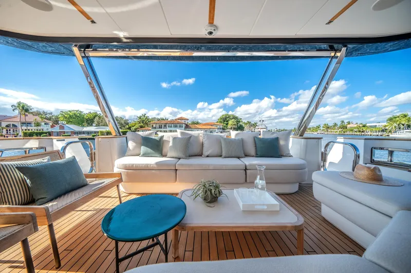 Slide: The Image of Luxurious Azimut Magellano 30M yacht deck with elegant seating, scenic waterfront view, 2026 model. - 39