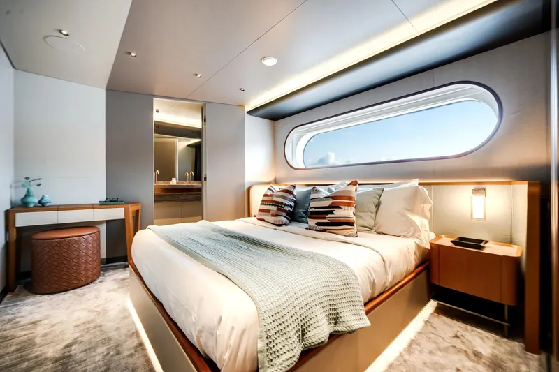 Slide: The Image of Luxurious bedroom interior of 2026 Azimut Magellano 30M yacht with modern design and large window. - 40