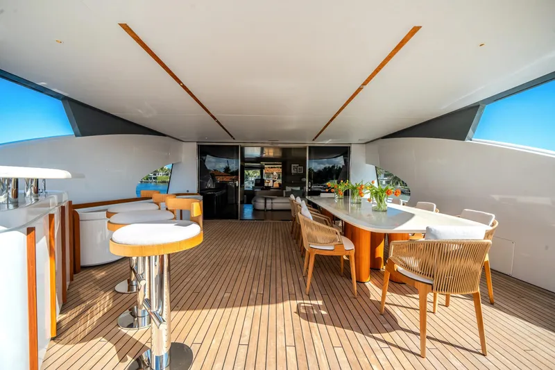 Slide: The Image of Luxurious deck of 2026 Azimut Magellano 30M yacht with elegant seating and bar area. - 52