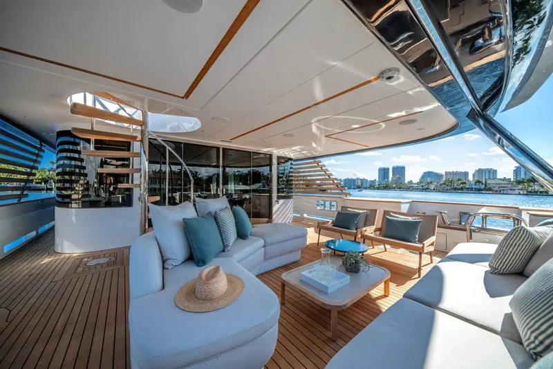 Slide: The Image of Luxurious 2026 Azimut Magellano 30M yacht deck with elegant seating and scenic waterfront view. - 54