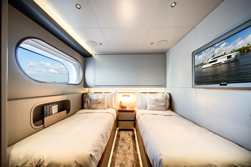 Slide: The Image of Luxurious twin cabin on 2026 Azimut Magellano 30M yacht with modern decor and ocean view. - 55