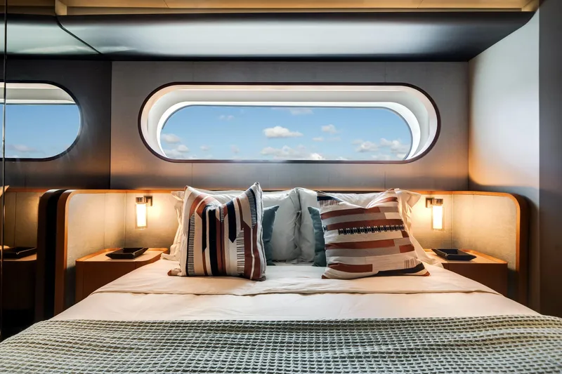 Slide: The Image of Luxurious bedroom interior of 2026 Azimut Magellano 30M yacht with ocean view window. - 56