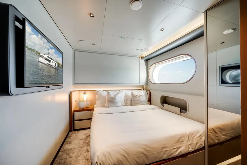 Slide: The Image of Luxurious bedroom interior of 2026 Azimut Magellano 30M yacht with modern design and large window. - 58