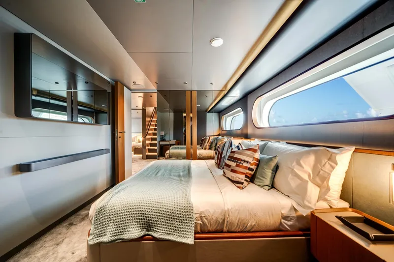 Slide: The Image of Luxurious bedroom interior of 2026 Azimut Magellano 30M yacht with modern design and ocean view. - 60