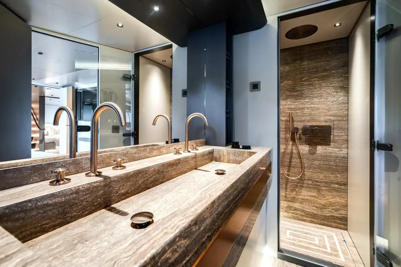 Slide: The Image of Luxurious bathroom on 2026 Azimut Magellano 30M yacht with dual sinks and modern shower. - 63