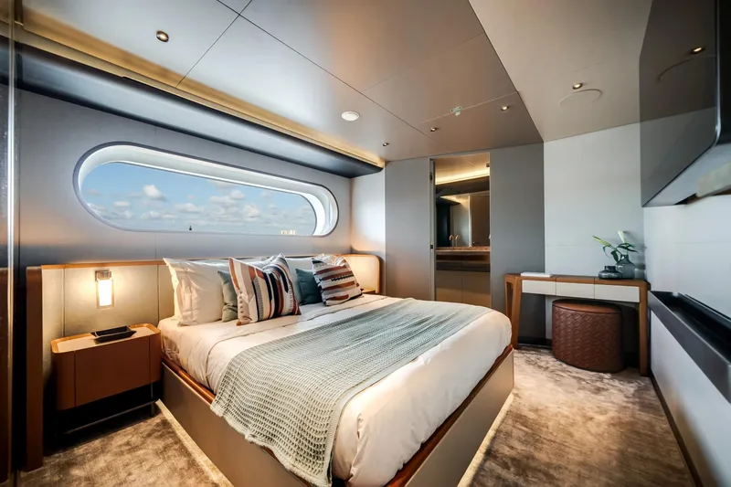 Slide: The Image of Luxurious bedroom interior of 2026 Azimut Magellano 30M yacht with ocean view window. - 64