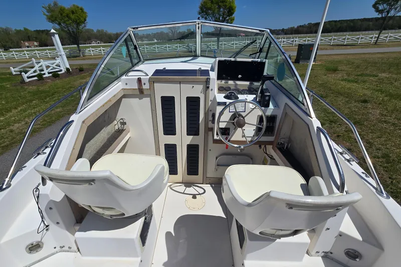 Slide: The Image of Interior view of a 1992 Grady White 226 boat with steering wheel and seating. - 11