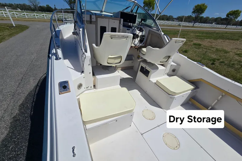 Slide: The Image of 1992 Grady White 226 boat interior with dry storage compartments. - 12