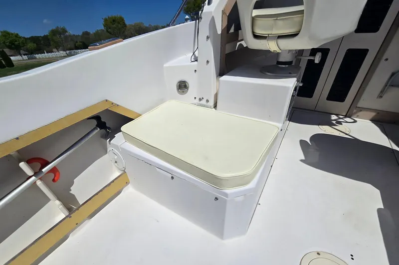 Slide: The Image of Interior of a 1992 Grady White 226 boat, featuring seating and storage. - 16