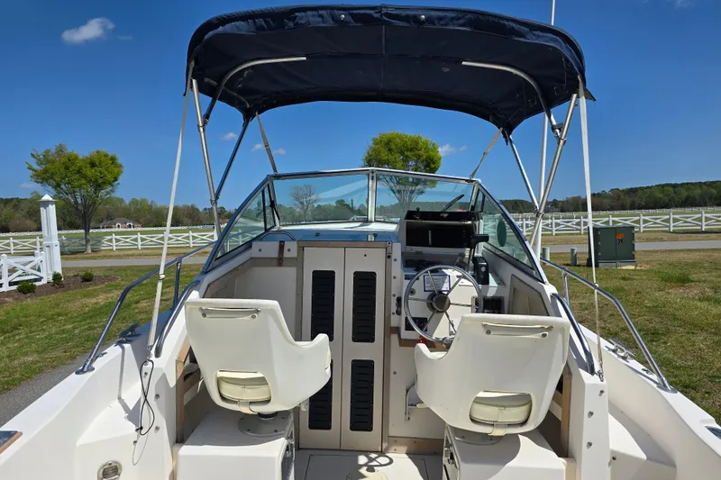 Slide: The Image of 1992 Grady White 226 boat interior with dual seats and steering wheel. - 17