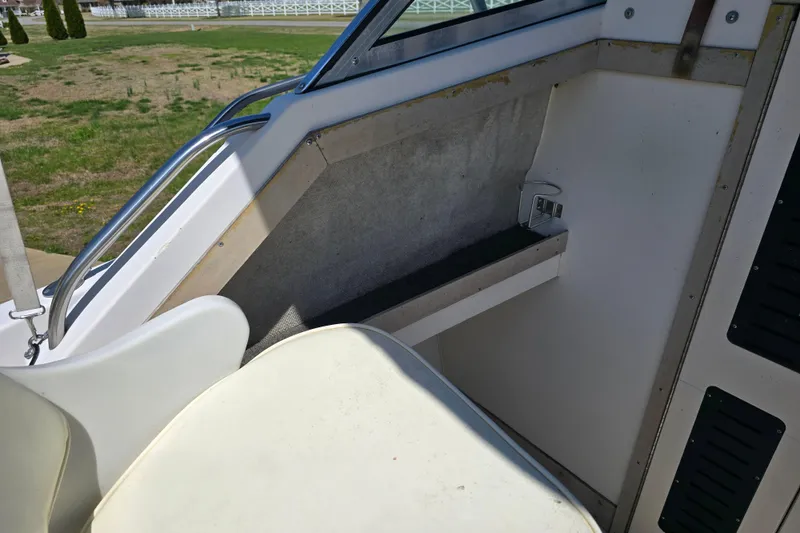 Slide: The Image of Interior view of a 1992 Grady White 226 boat, featuring seating and railing. - 27