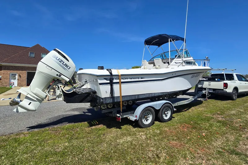 Slide: The Image of 1992 Grady White 226 boat on trailer with Suzuki outboard motor. - 7
