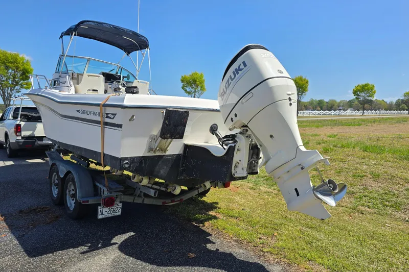 Slide: The Image of 1992 Grady White 226 boat on trailer with Suzuki outboard motor. - 9