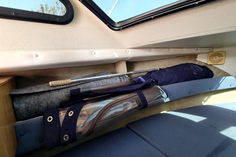 Slide: The Image of Interior of 2001 Skipjack 262 Flybridge with fishing gear and storage area. - 21