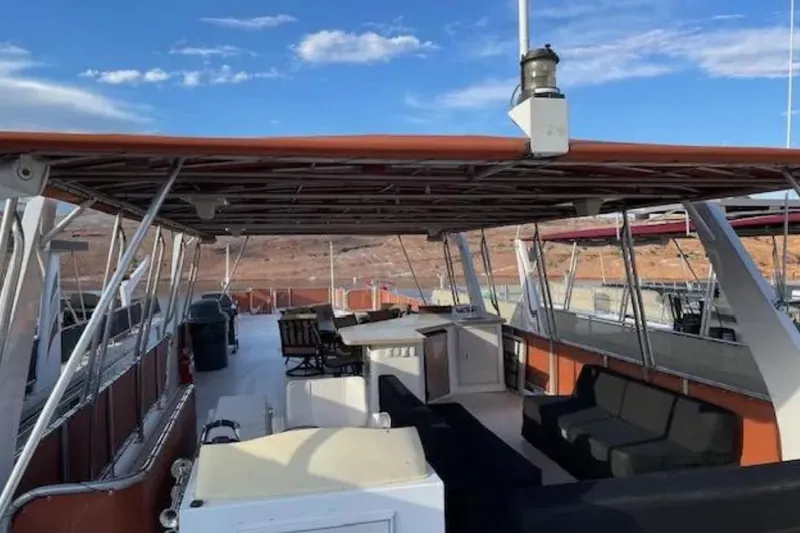 Slide: The Image of Upper deck of 2007 American Waterways Sundancer, featuring seating and open views. - 14