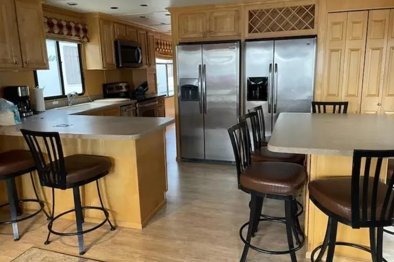 Slide: The Image of Spacious kitchen on American Waterways Sundancer Trip, featuring modern appliances and bar seating, 2007. - 6