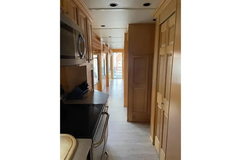 Slide: The Image of Interior view of 2007 American Waterways Sundancer Trip #15, featuring a narrow hallway and kitchen area. - 7