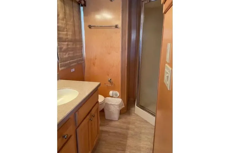 Slide: The Image of Bathroom interior of 2007 American Waterways Sundancer Trip #15, featuring sink and shower. - 9