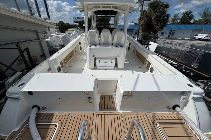 Slide: The Image of 2026 World Cat 400 CC-X boat interior with spacious deck and seating. - 13
