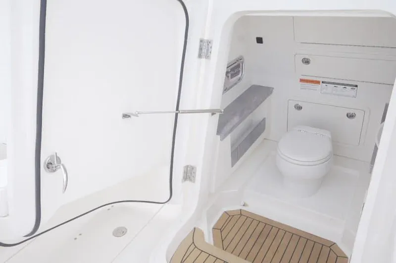 Slide: The Image of Manufacturer Provided Image: 2026 World Cat 400 CC-X boat interior with modern bathroom amenities. - 15