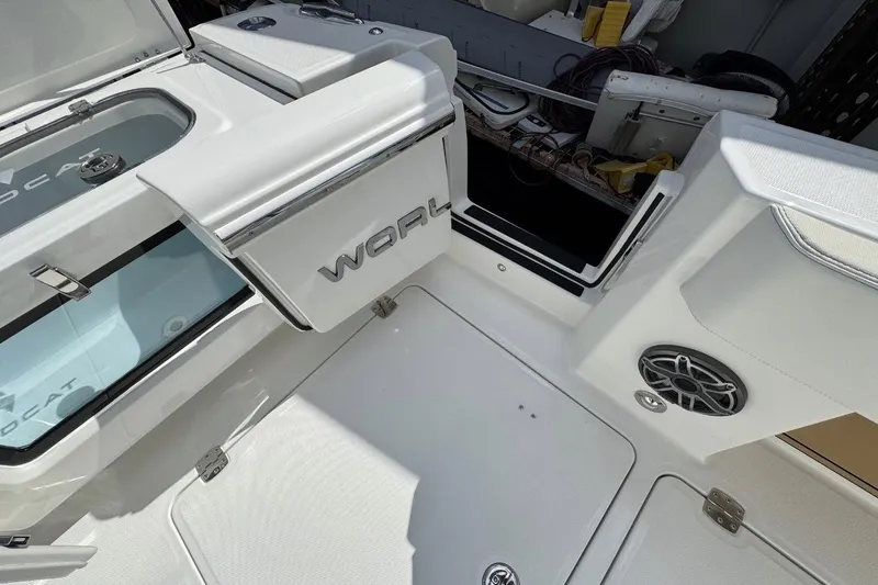 Slide: The Image of 2026 World Cat 400 CC-X boat interior with storage compartments and speaker. - 16