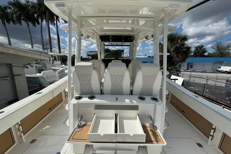 Slide: The Image of 2026 World Cat 400 CC-X boat interior with luxurious seating and storage drawers. - 17