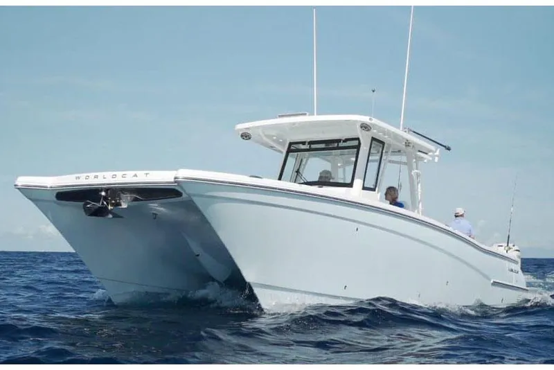 Slide: The Image of Manufacturer Provided Image: 2026 World Cat 400 CC-X boat cruising on open ocean waters. - 2
