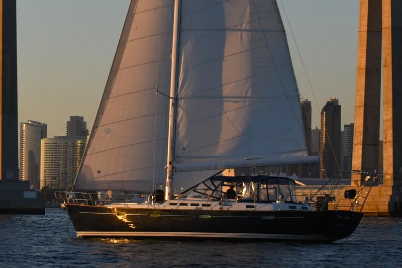 The Image of Sailing yacht Beneteau 57, 2003 model, cruising near city skyline at sunset. - 0