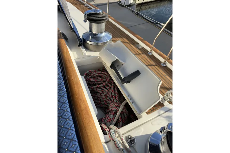 Slide: The Image of Deck of 2003 Beneteau 57 sailboat with winch and rope storage. - 103