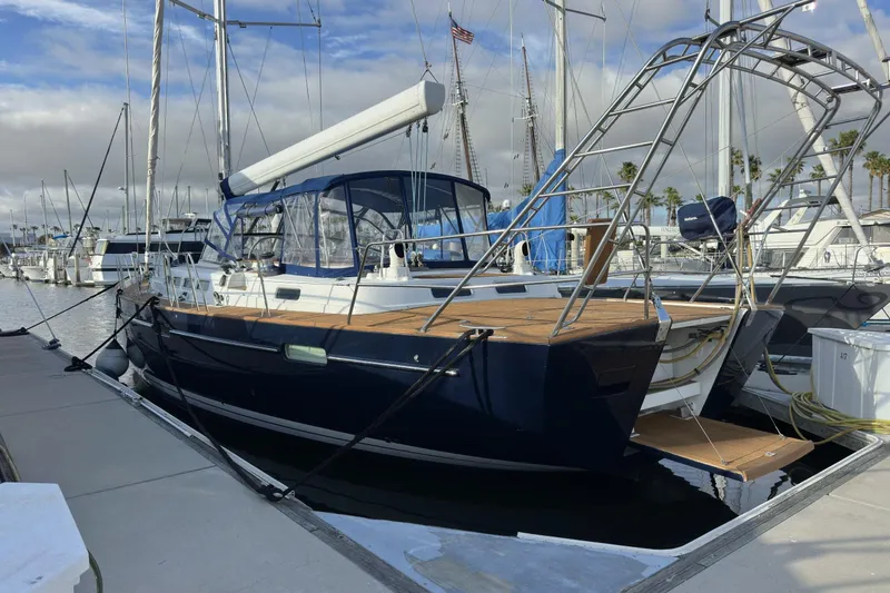 Slide: The Image of Sailing yacht Beneteau 57, 2003 model, docked at marina with clear skies. - 104